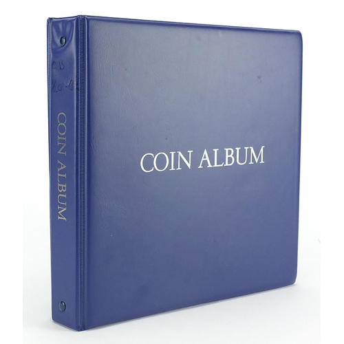 213 - George III and later silver and other British coinage arranged in an album including George III 1818... 