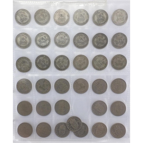 215 - George III and later silver and other British coinage arranged in an album including shillings, six ... 