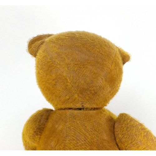 331 - Vintage golden straw filled teddy bear with jointed limbs and beaded glass eyes, 62cm high