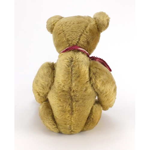 330 - Vintage golden straw filled teddy bear with jointed limbs and beaded glass eyes, 63cm high