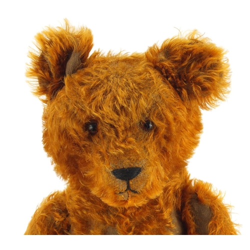 333 - Vintage golden straw filled teddy bear with jointed limbs and beaded glass eyes, 65cm high