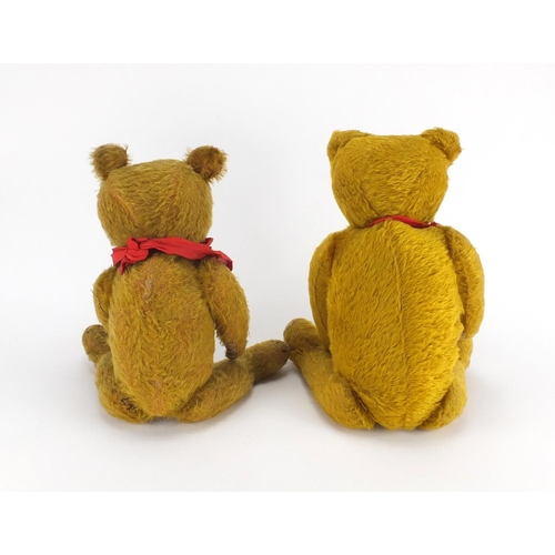 335 - Two vintage golden straw filled teddy bear's with jointed limbs and beaded eyes, one with growler, t... 