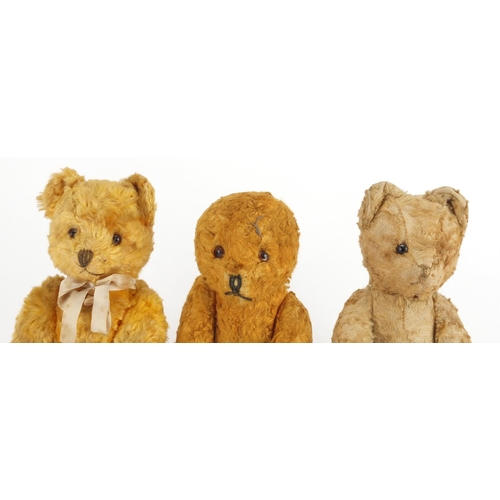 338 - Three vintage golden teddy bear's each with jointed limbs and beaded eyes, the largest 22cm high