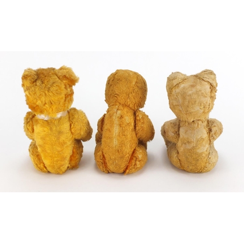 338 - Three vintage golden teddy bear's each with jointed limbs and beaded eyes, the largest 22cm high