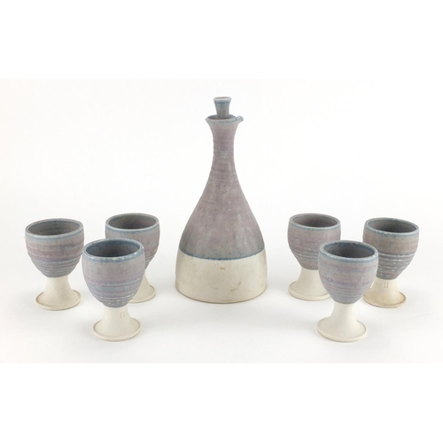 593 - St Ives Studio pottery wine bottle and six matching goblets, impressed marks and dated 1973, the lar... 