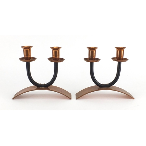 611 - Pair of Modernist copper twin candlesticks, each 18cm high