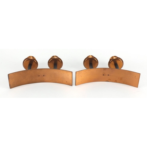 611 - Pair of Modernist copper twin candlesticks, each 18cm high