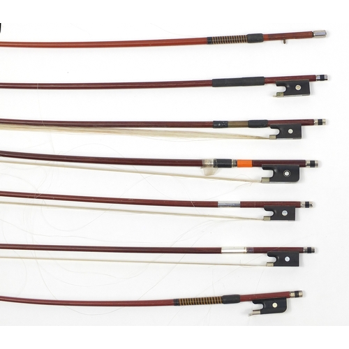 146 - Collection of wooden violin bows, some with Mother of Pearl frogs including examples by P & H London