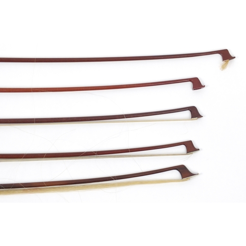 146 - Collection of wooden violin bows, some with Mother of Pearl frogs including examples by P & H London