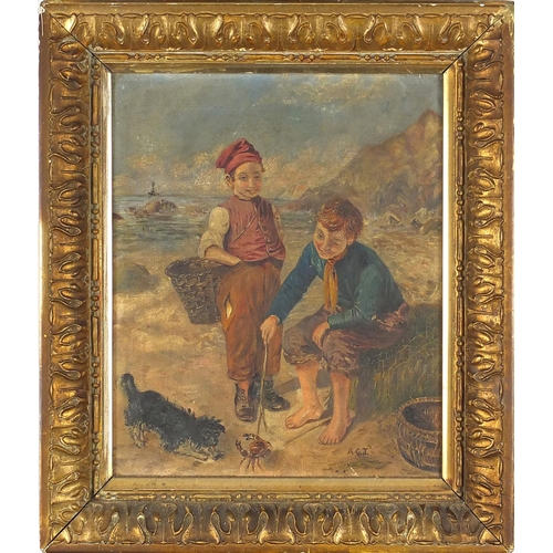 890 - Two boys on a beach playing with a crab, Irish school oil on canvas, bearing a monogram AGT, mounted... 