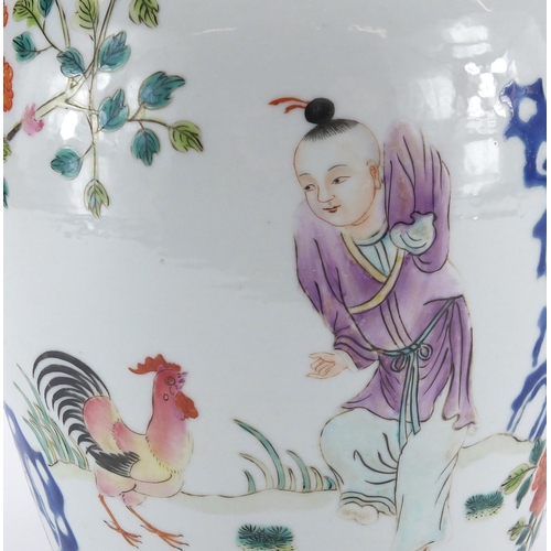 350 - Chinese porcelain jar and cover hand painted in the famille rose palette, with a figure playing with... 