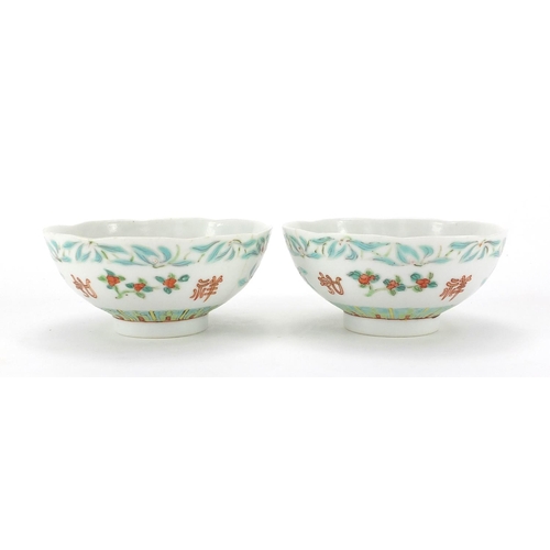 360 - Pair of Chinese porcelain footed bowls, hand panted with flowers, six figure iron red character mark... 