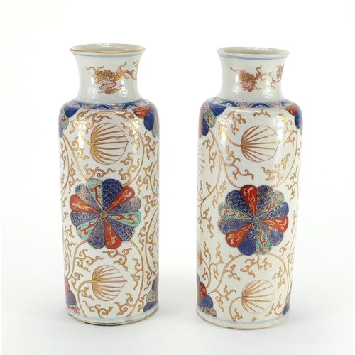 363 - Pair of Chinese porcelain cylindrical vases, possibly Kangxi period, both hand painted in the Imari ... 