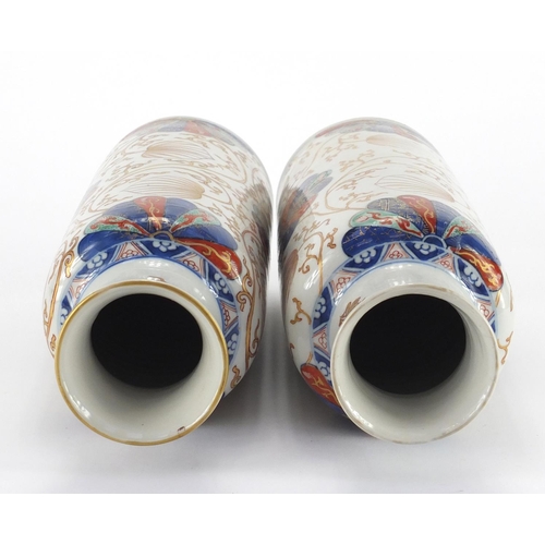 363 - Pair of Chinese porcelain cylindrical vases, possibly Kangxi period, both hand painted in the Imari ... 