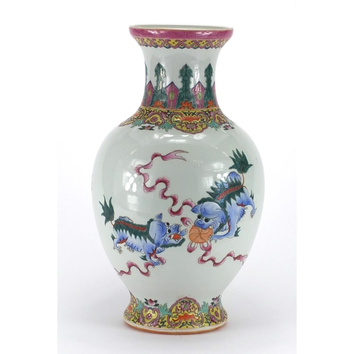 364 - Chinese porcelain baluster vase, hand painted in the famille rose palette with kylin lions chasing t... 