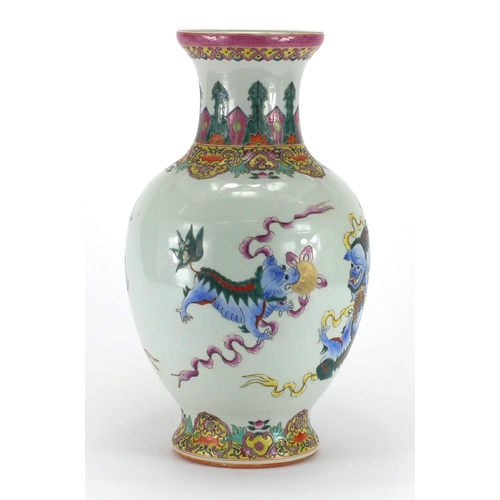 364 - Chinese porcelain baluster vase, hand painted in the famille rose palette with kylin lions chasing t... 