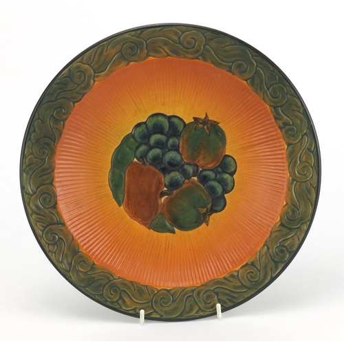 594 - Danish pottery dish by Peter Ipsens Enke, hand painted and decorated in relief with fruit, impressed... 