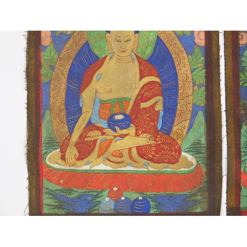 460 - Pair of Sino Tibetan silk panels, both hand painted with Buddha, each 37cm x 28cm