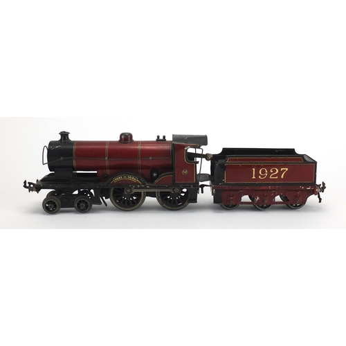 311 - OO gauge Duke of York clockwork locomotive and tender numbered 1927, 23cm in length