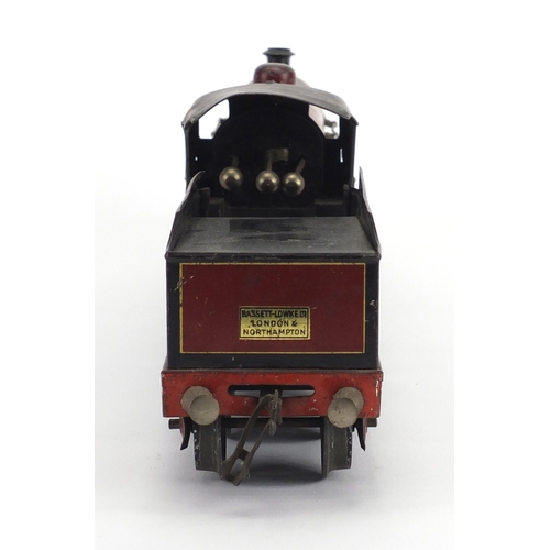 311 - OO gauge Duke of York clockwork locomotive and tender numbered 1927, 23cm in length