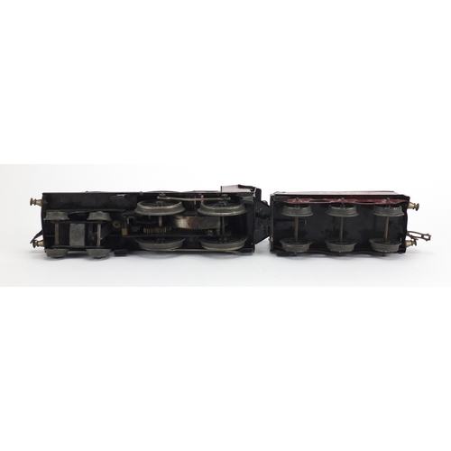 311 - OO gauge Duke of York clockwork locomotive and tender numbered 1927, 23cm in length