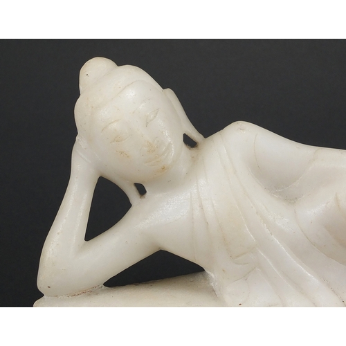 478 - Oriental white marble carving of a reclining Deity, 27.5cm in length