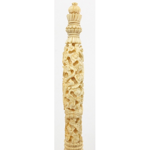 441 - Chinese Canton ivory puzzle, the handle carved with dragons amongst clouds, 26cm in length