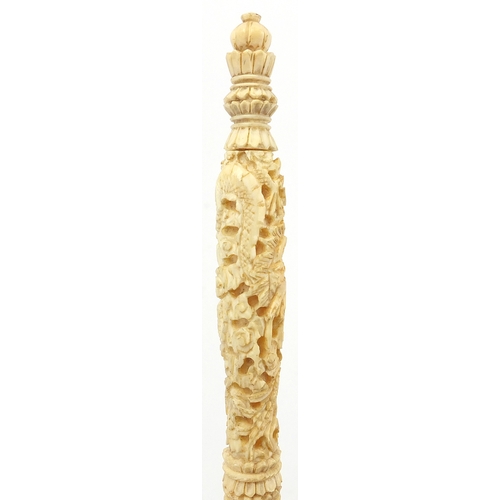 441 - Chinese Canton ivory puzzle, the handle carved with dragons amongst clouds, 26cm in length