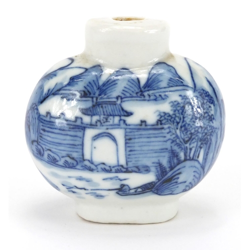 375 - Chinese blue and white porcelain snuff bottle, hand painted with figures crossing a bridge before a ... 