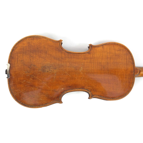 134 - Old wooden violin with one piece back and scrolled neck, together with two unnamed violin bows and f... 