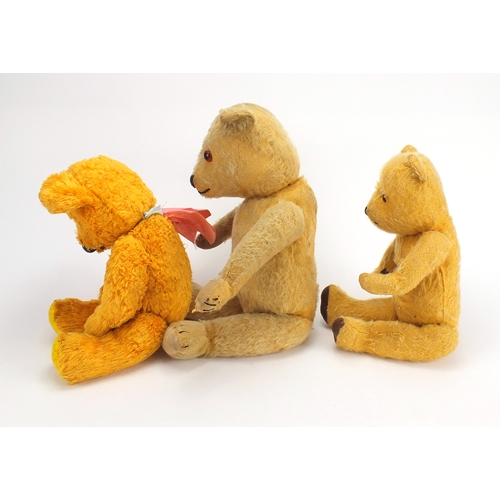 336 - Three vintage teddy bear's including a straw filled example, all with jointed limbs and beaded eyes,... 