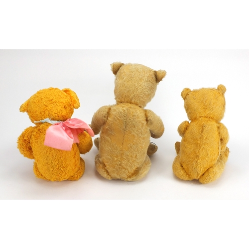 336 - Three vintage teddy bear's including a straw filled example, all with jointed limbs and beaded eyes,... 