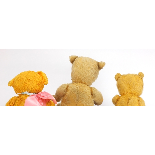 336 - Three vintage teddy bear's including a straw filled example, all with jointed limbs and beaded eyes,... 