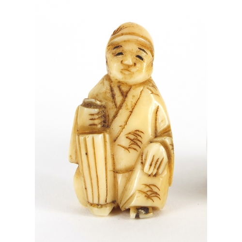 448 - Two Japanese carved Netsuke's, one of a seated figure, the largest 3cm high