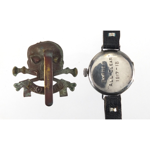282 - Military interest silver cased trench watch with enamelled dial and Roman numerals with cap badge