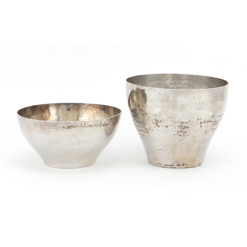 630 - Two Arts and Crafts unmarked silver bowls with planished decoration, the largest 8cm high