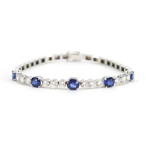 676 - 18ct white gold graduated Sapphire and Diamond bracelet, 18cm in length, approximate weight 13.9g