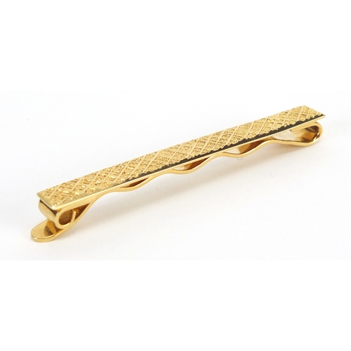 714 - 18ct gold Cartier tie slide, numbered L8766, 6cm in length, approximate weight 9.0g