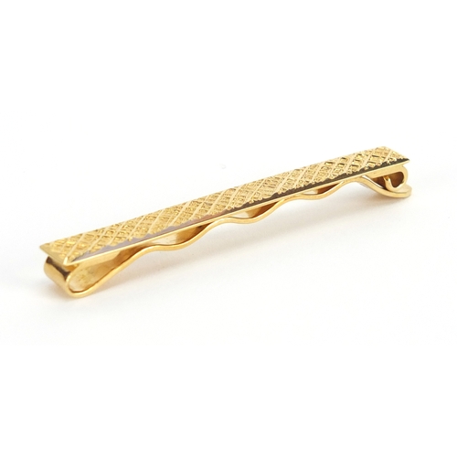 714 - 18ct gold Cartier tie slide, numbered L8766, 6cm in length, approximate weight 9.0g