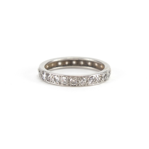 694A - Unmarked white metal diamond eternity ring, size O, approximate weight 3.4g