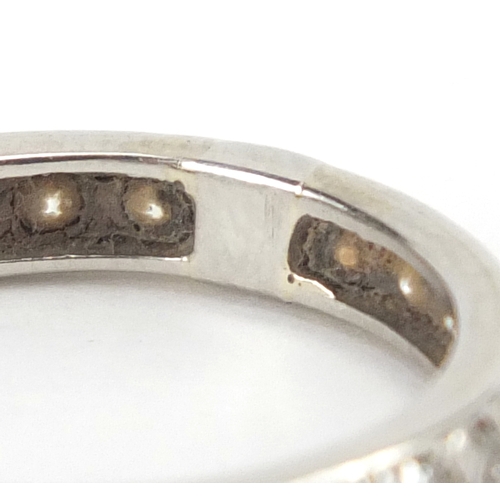 694A - Unmarked white metal diamond eternity ring, size O, approximate weight 3.4g