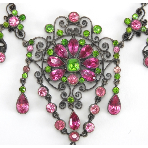 679 - 800 grade silver suffragette necklace and brooch set with pink and green stones, housed in a Hamilto... 