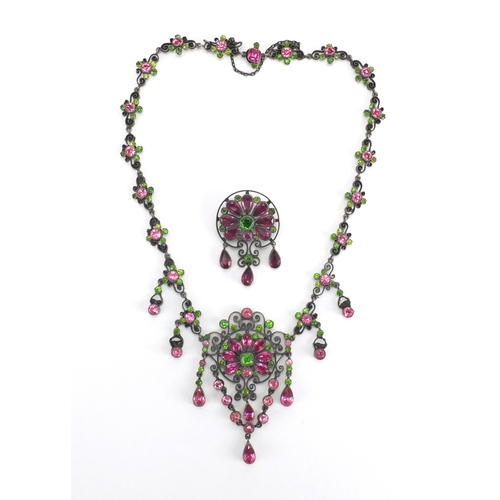 679 - 800 grade silver suffragette necklace and brooch set with pink and green stones, housed in a Hamilto... 