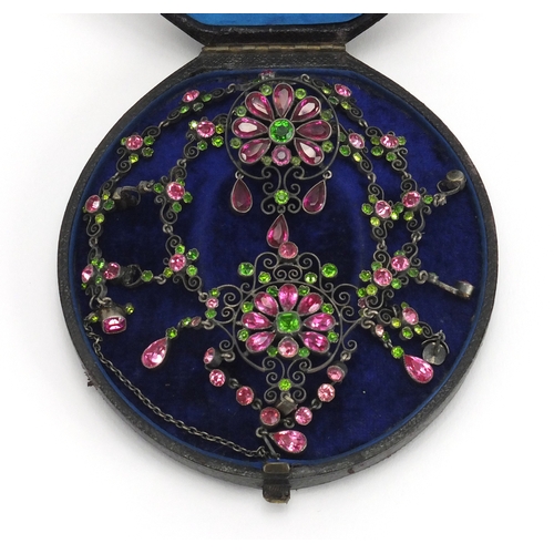 679 - 800 grade silver suffragette necklace and brooch set with pink and green stones, housed in a Hamilto... 