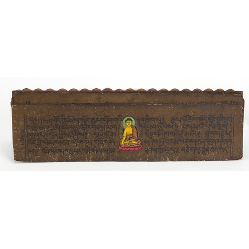 473 - Tibetan carved wood prayer box set with turquoise and coral stones, containing various paper scriptu... 