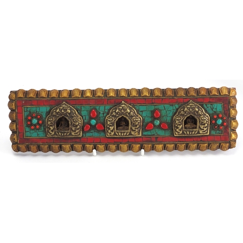 473 - Tibetan carved wood prayer box set with turquoise and coral stones, containing various paper scriptu... 