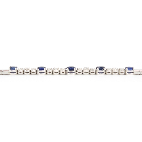 676 - 18ct white gold graduated Sapphire and Diamond bracelet, 18cm in length, approximate weight 13.9g