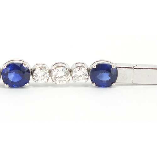 676 - 18ct white gold graduated Sapphire and Diamond bracelet, 18cm in length, approximate weight 13.9g