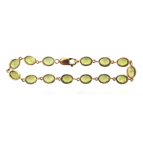 710 - 9ct gold Peridot bracelet, 18cm in length, approximate weight 13.5g