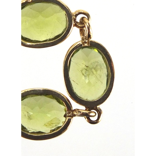 710 - 9ct gold Peridot bracelet, 18cm in length, approximate weight 13.5g